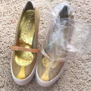 Cream and gold with mesh, etc., close toed wedge with strap over front of foot